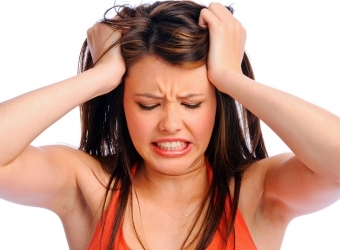 Woman Having Migraines Or Tension Headaches Before Having Massage In York