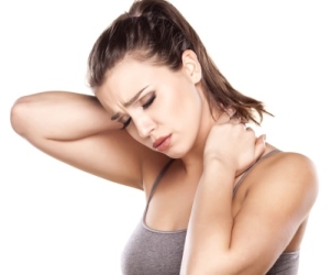 Woman giving her Neck and shoulders a massage