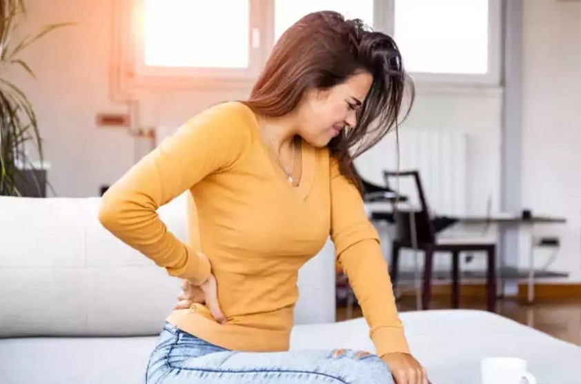 woman with bad back needing massage at home