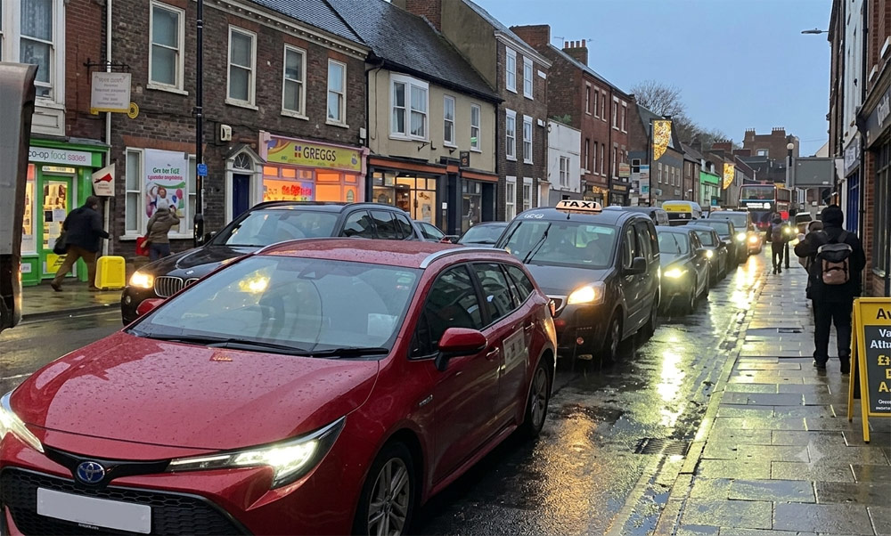 Gridlocked traffic in York illustrating the stress of traveling to a clinic compared to home sports massage.